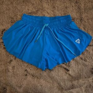 Blue flowy athletic shorts